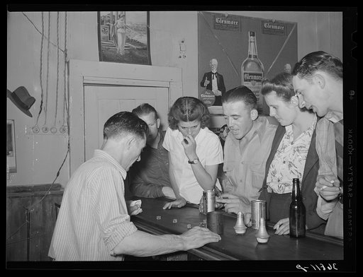 Shooting for the drinks. Barroom at Mogollon, New Mexico