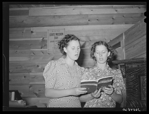 Two sisters singing a duet at the community sing. Pie Town, New Mexico