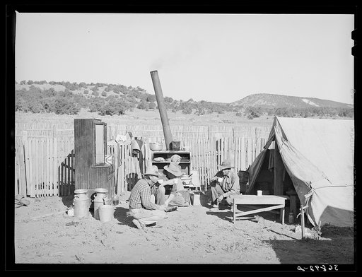 Fargo Caudill and neighbors who are helping him rebuild his dugout have a cup of coffee. Pie Town, New Mexico