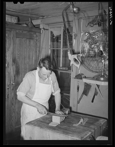 Butcher at the commissary. Mogollon, New Mexico