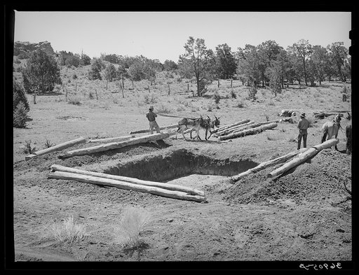 Faro Caudill and neighbor building dugout. Pie Town, New Mexico