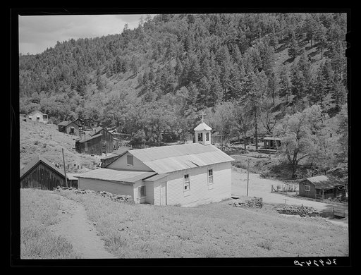 Church surrounded by miners' homes. Mogollon, New Mexico