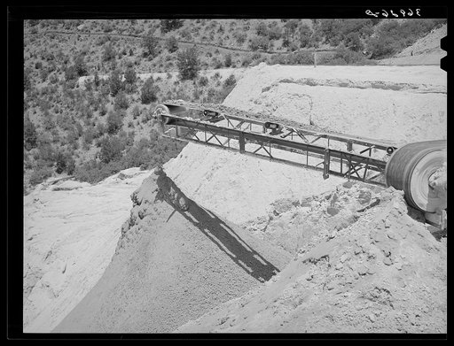 Belt conveyor which drops the tailings onto pile in the valley below. Mill at Mogollon, New Mexico