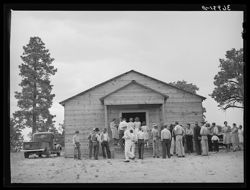 Crowd outside the church during the dinner hour at the community sing. Pie Town, New Mexico