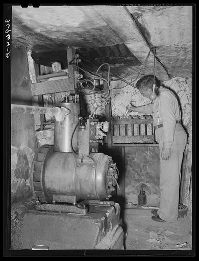 Mr. Keele filling the batteries in one of the two Delco systems in Pie Town, New Mexico