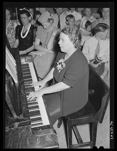 Pianist at community sing. Pie Town, New Mexico. She and her husband were one of the first homesteaders