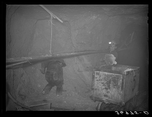 Untitled photo, possibly related to: Mucking gold ore at mine. Mogollon, New Mexico
