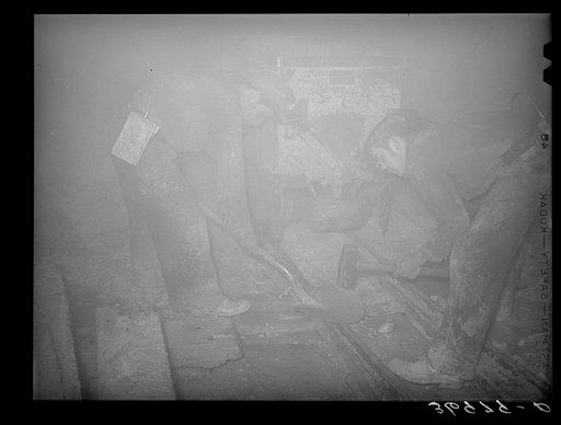 Untitled photo, possibly related to: Mucking gold ore at mine. Mogollon, New Mexico