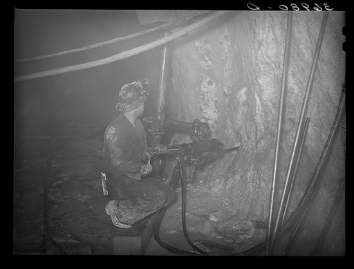 Operating pneumatic drill in gold mine. Mogollon, New Mexico