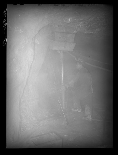 Untitled photo, possibly related to: Gold miner operating pneumatic drill at Mogollon, New Mexico