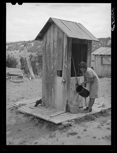 Covered well on Spanish-American family. Chamisal, New Mexico