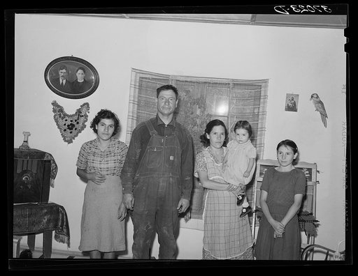 Spanish-American farmer and his family, Chamisal, New Mexico