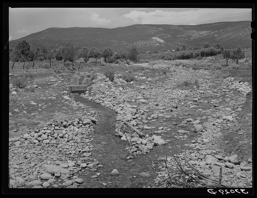 Creek with diversional channel to irrigation ditch on the left, Chamisal. New Mexico