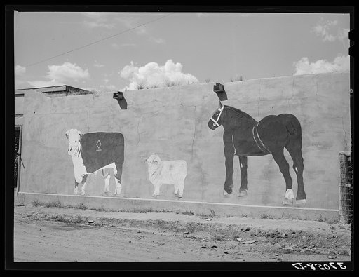 Native art on adobe wall. Amalia, New Mexico