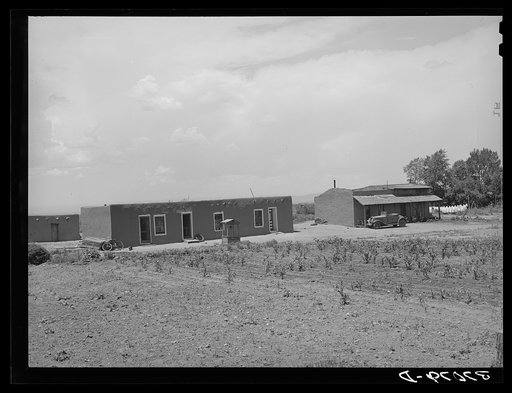 Untitled photo, possibly related to: Adobe house with small patch of corn. Costilla, New Mexico
