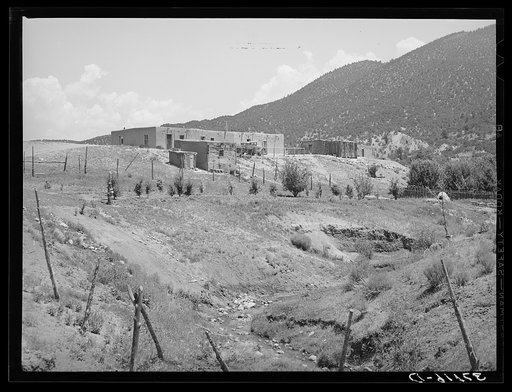Spanish-American farmstead with stream running past. Amalia, New Mexico
