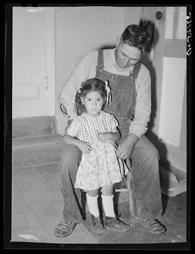 Spanish-American farmer with his daughter. Chamisal, New Mexico