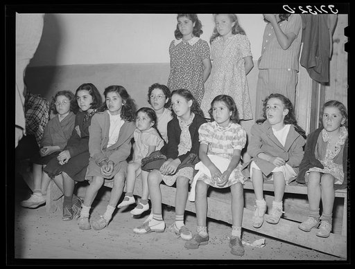 Spanish-American children watching show. Penasco, New Mexico