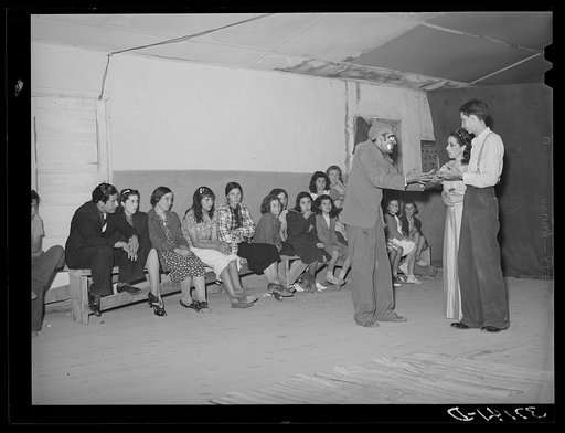 Players and audience at traveling Spanish-American show. Penasco, New Mexico