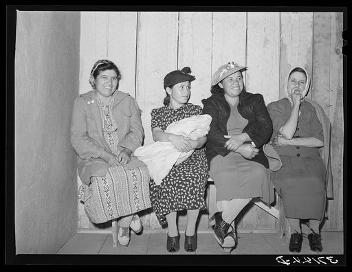 Spanish-American women waiting to see doctor at the traveling clinic at Chamisal, New Mexico