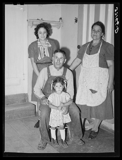 Spanish-American farmer and his family. Chamisal, New Mexico
