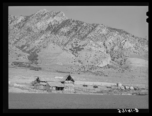 Barns of Mormon farmer in Box Elder County, Utah. Notice the sheepherder's wagon. Grazing of sheep and cattle is an important part of farms in this section