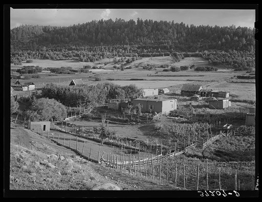 Spanish-American farmstead with farming land in background. Llano de San Juan, New Mexico