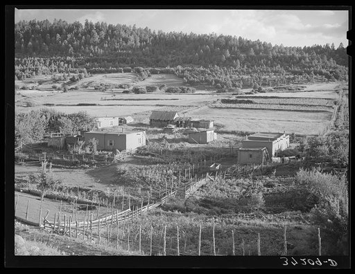 Untitled photo, possibly related to: Spanish-American farmstead with farming land in background. Llano de San Juan, New Mexico