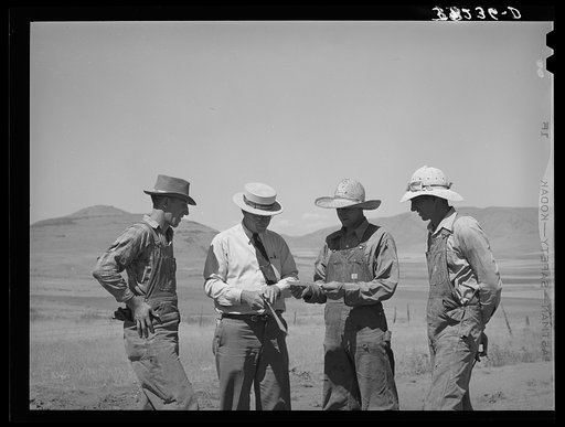 Mr. Thayne, cooperative specialist of FSA (Farm Security Administration), presenting check to the three Ericson brothers to buy a cooperative tractor. Box Elder County, Utah