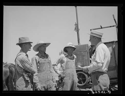 Mr. Thayne, FSA (Farm Security Administration) cooperative specialist, talking to the three Ericson brothers. Box Elder County, Utah