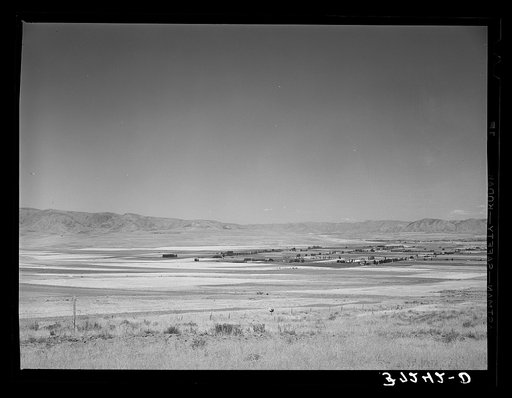 Snowville, Utah, Mormon farming community, wherein all farmers live while three fields lie on the outskirts of the town