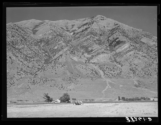 The Mormon farms are invariably situated in the foot of the mountains to take advantage of the mountain streams. Box Elder County, Utah