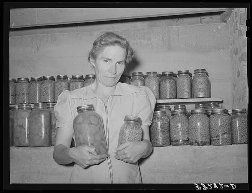 Wife of Mormon farmer with canned goods. Snowville, Utah
