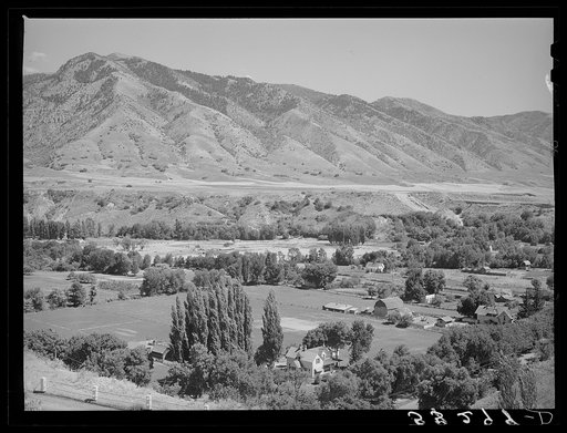 Farms on the outskirts of Logan, Utah, Cache County. At the foot of the mountain one of the levels of ancient Lake Bonneville can be seen
