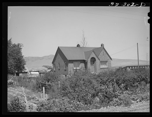 Home of Mormon farmer, one of the Ericson brothers, who are FSA (Farm Security Administration) clients. Box Elder County, Utah
