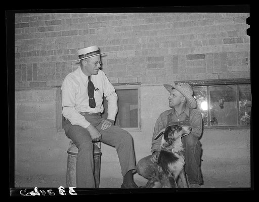 Mr. Thayne, FSA (Farm Security Administration) cooperative specialist, talking to one of the Ericson brothers about forming a cooperative tractor society. Box Elder County, Utah