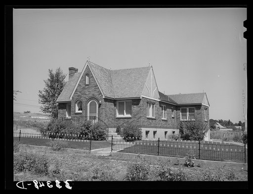 Untitled photo, possibly related to: Houses belonging to a Mormon farmer in Mendon, Utah. The new house was built with profits from his farm