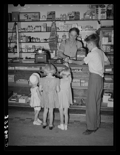 Mormon children buying candy at store. Mendon, Utah