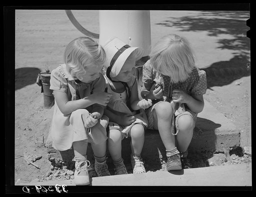 Three little Mormon girls with candy. Mendon, Utah