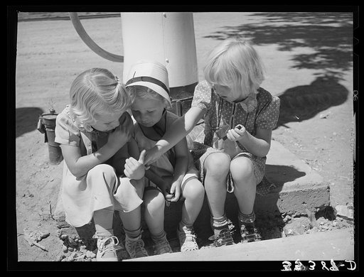 Three little Mormon girls with candy. Mendon, Utah