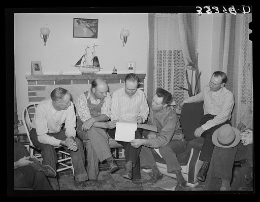 FSA (Farm Security Administration) county supervisor, center, looks over the books of the FSA cooperative stallion organization. Box Elder County, Utah