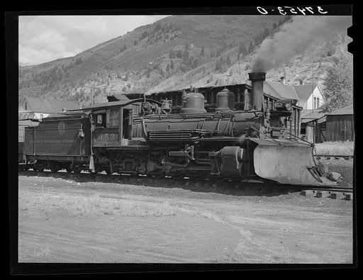 Locomotive of the D. and R.G.W. railroad with snowplow attached. Telluride, Colorado