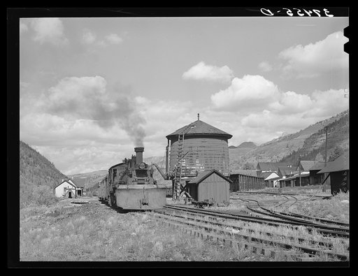 Untitled photo, possibly related to: Narrow gauge railway yards, train and water tank at Telluride, Colorado