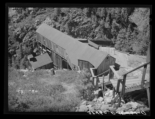 Looking towards the cable house of an aerial tram which carries ore down from mine to mill. Ouray County, Colorado
