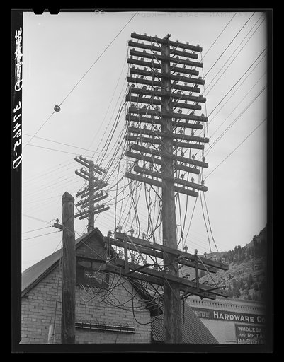 Electrical wiring left to disintegrate following the slowdown of mining operations and the partial abandonment of the town. Telluride, Colorado