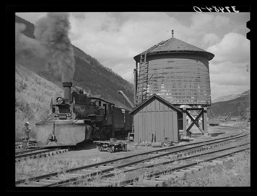 Untitled photo, possibly related to: Narrow gauge railway yards, train and water tank at Telluride, Colorado
