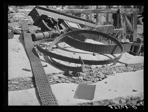 Remains of abandoned gold mill equipment steel web belt and pulleys. Telluride, Colorado