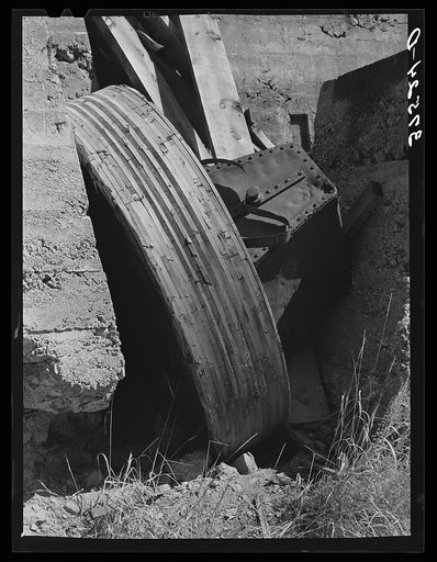 Abandoned equipment at gold mill showing laminated wooden wheels. Telluride, Colorado