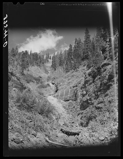Untitled photo, possibly related to: Platform at entrance to tunnel. The gold ore taken from the tunnel requires a built-up platform at the entrance to facilitate handling. Telluride, Colorado