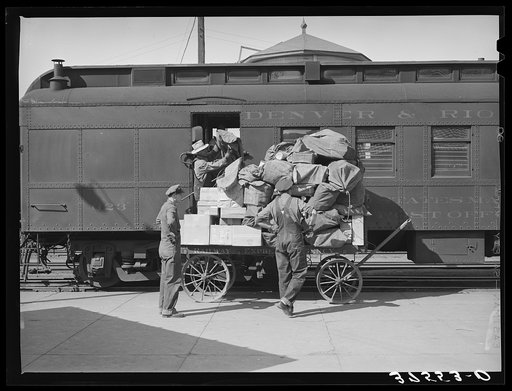 Unloading the mail from the morning train. Montrose, Colorado